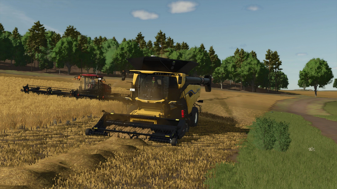 FS25 mods: Combine harvester in wheat field with Filllevel Warning mod active in Farming Simulator 25.