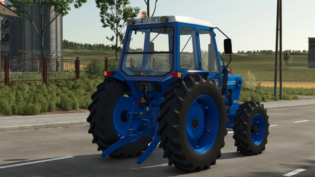 Ford 6600 tractor mod in FS25, showcasing vibrant blue design and rear view.