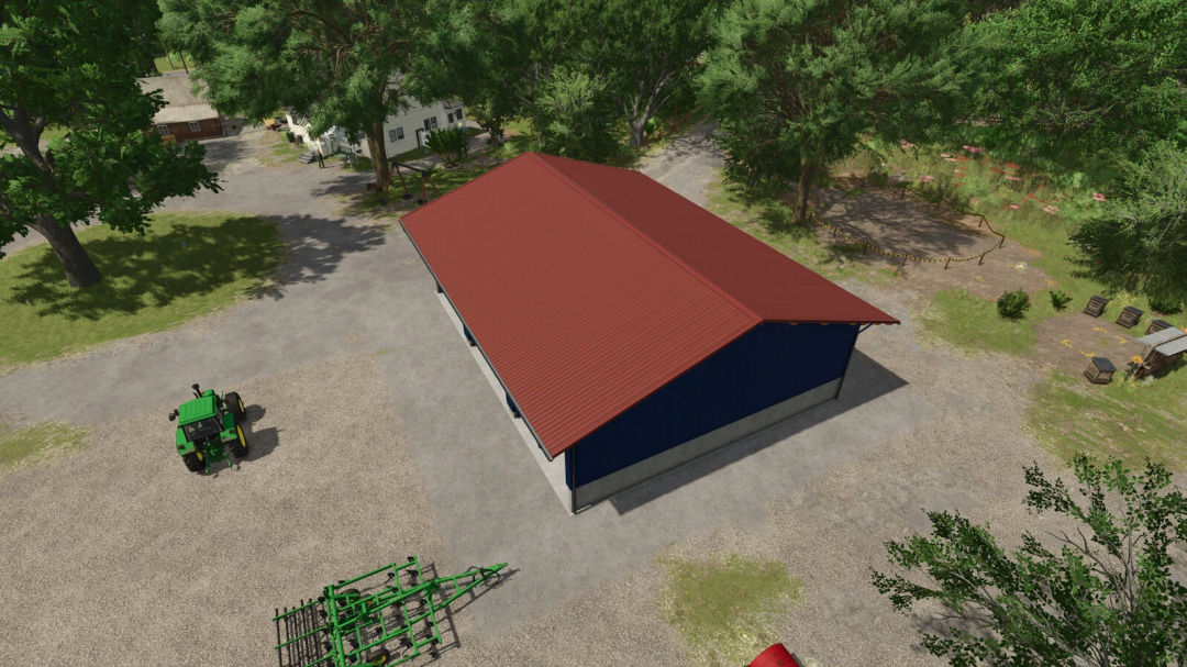 Aerial view of a garage with a red roof in FS25 mod 'Garage With Vehicle Workshop v1.0.0.0', featuring surrounding trees and a tractor.