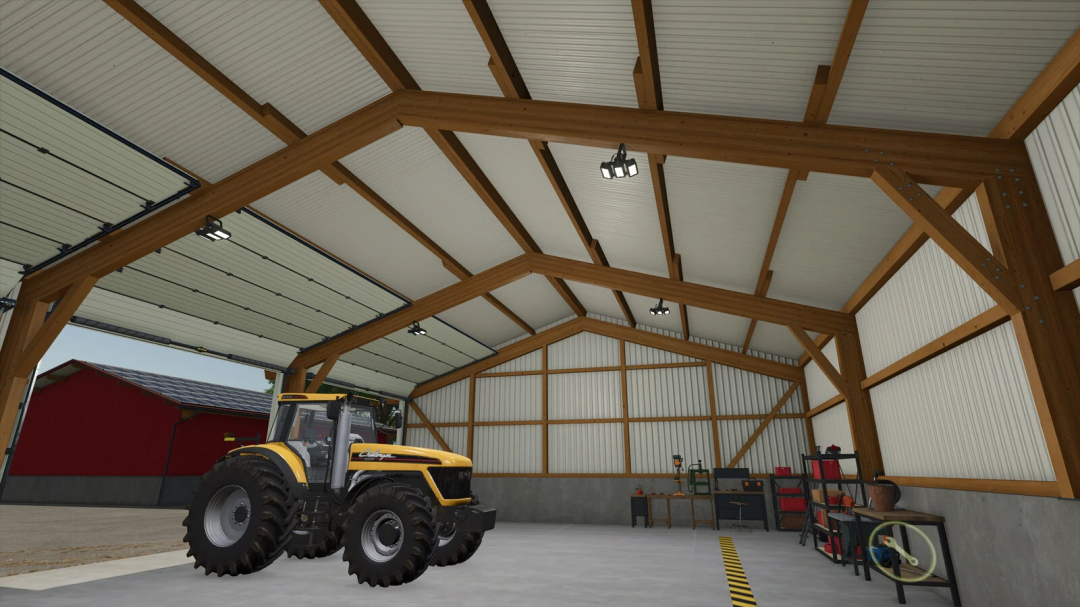 Interior of a garage with vehicle workshop in FS25 mods, featuring a yellow tractor and organized tools.