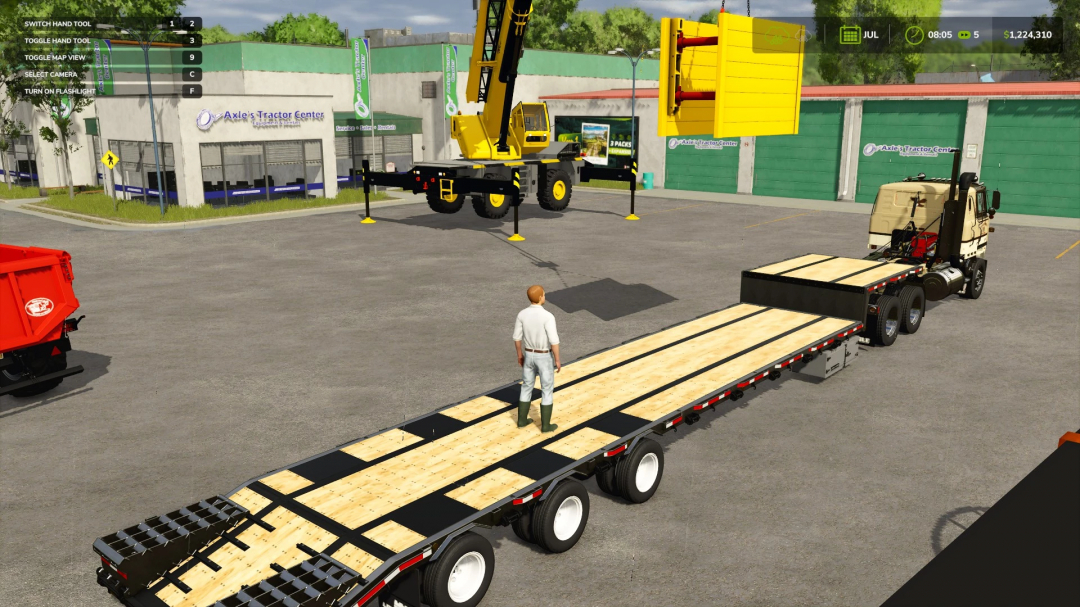 FS25 mod featuring Grove GRT 655 Rough Terrain Crane in a parking lot with a character on a trailer.