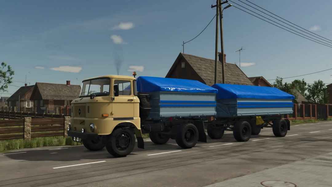 IFA W50 truck with blue swap bodies on a rural road in FS25 mod.