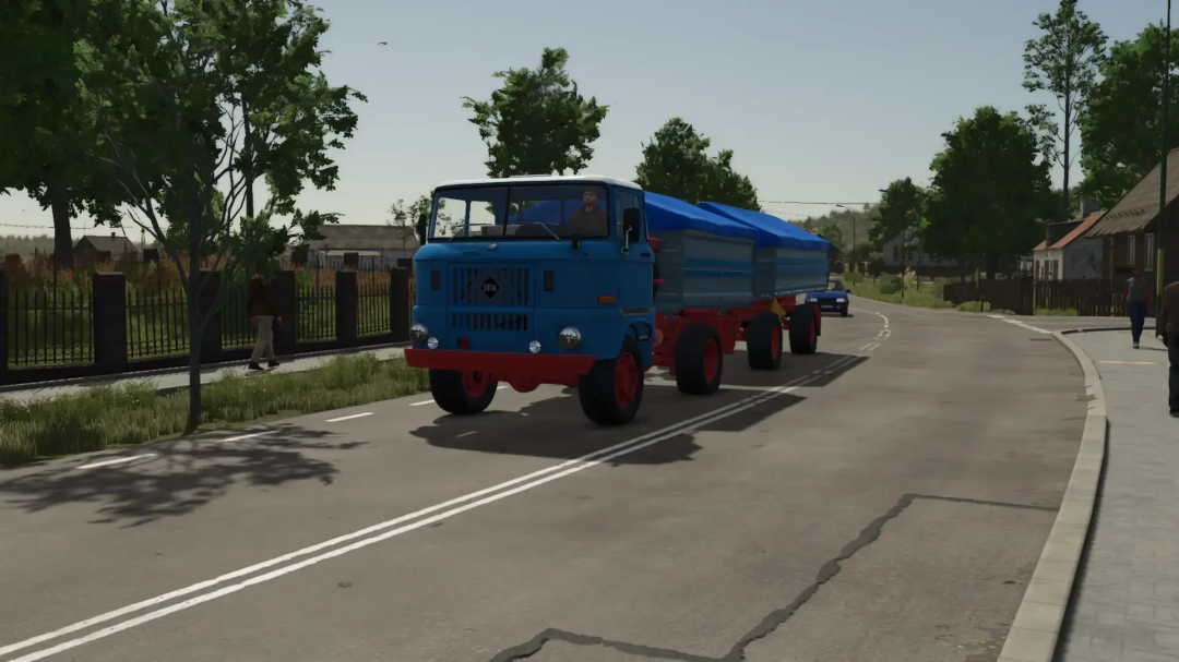 IFA W50 truck with swap bodies in FS25 mod, driving through rural road, showcasing Farming Simulator 25 mods.