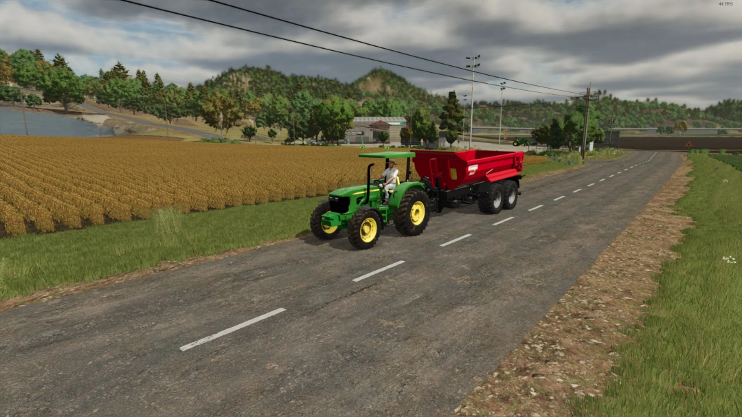 John Deere 50E Series tractor towing a red trailer on a rural road in FS25 mod.