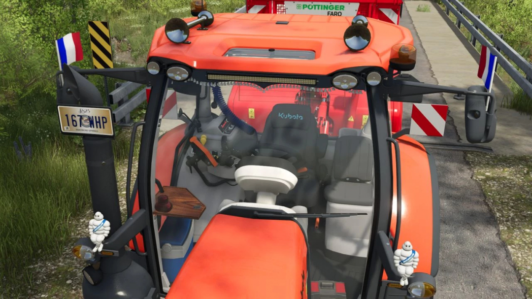 Kubota M7 Edit v1.0.0.0 mod for FS25, showcasing tractor interior details and attached equipment.