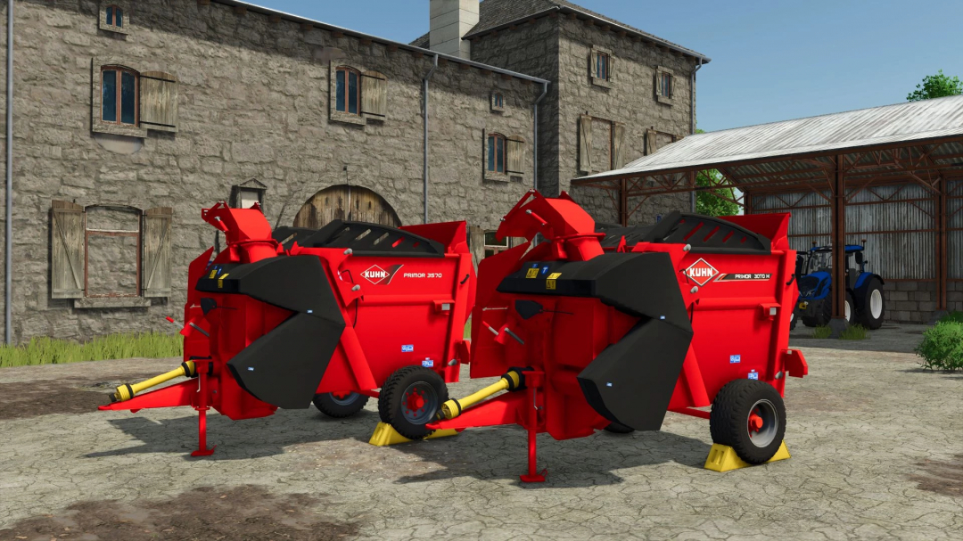 Kuhn Primor 3570 mod for FS25, featuring red agricultural machinery near a barn.