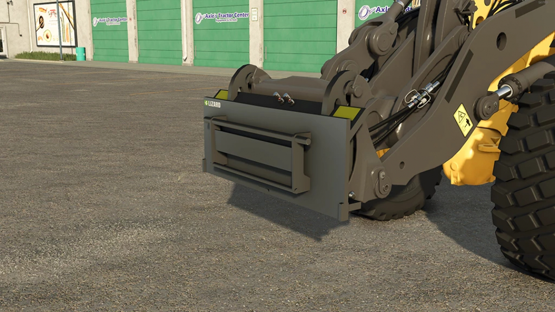 Lizard Wheel Loader Adapter in FS25 mod outside a garage.