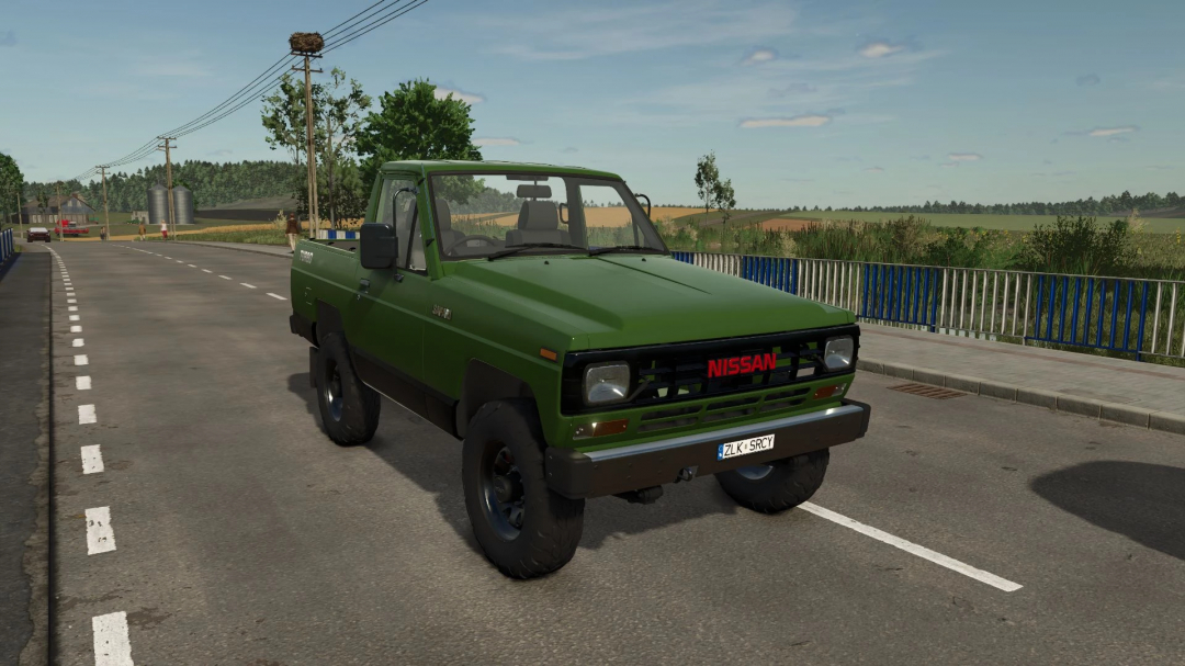 Green 1985 Nissan Safari mod for Farming Simulator 25 on a rural road. FS25 mods enhance gameplay with classic vehicles.