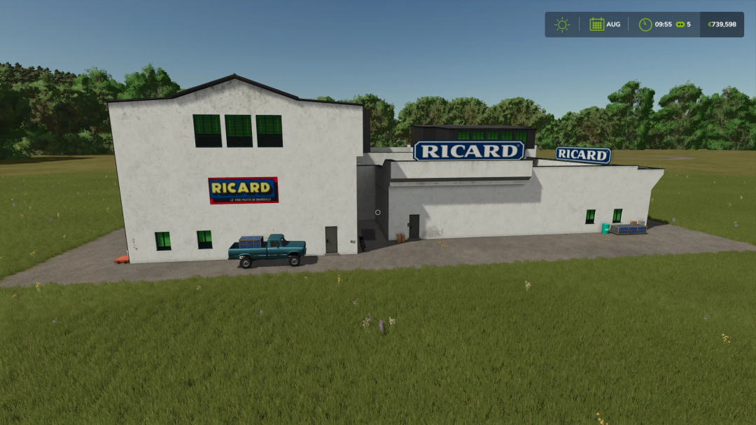 FS25 mod RICARD PRODUCTION building with truck parked outside, grassy field in foreground.