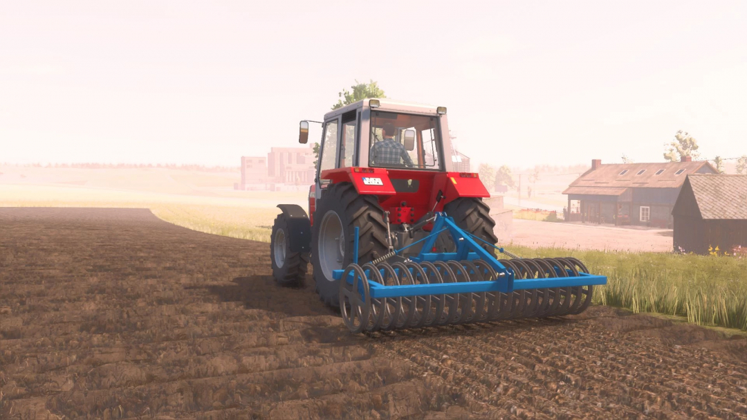 Tractor using Rabe Discotass 3000 mod in FS25, cultivating a field near farm buildings.