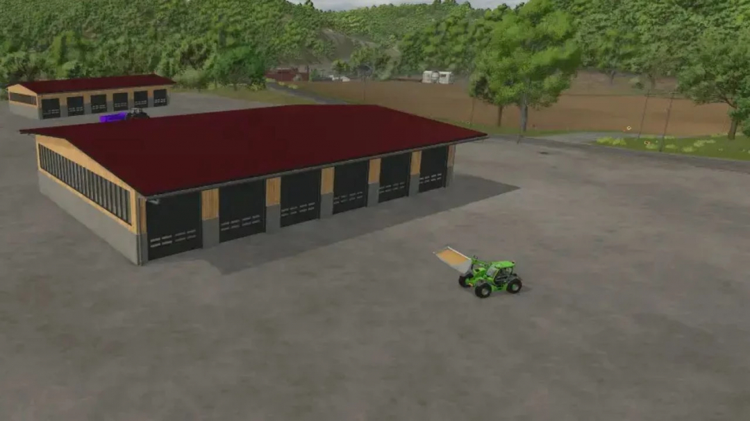 Storage hangars mod in FS25 featuring large buildings and a green vehicle.