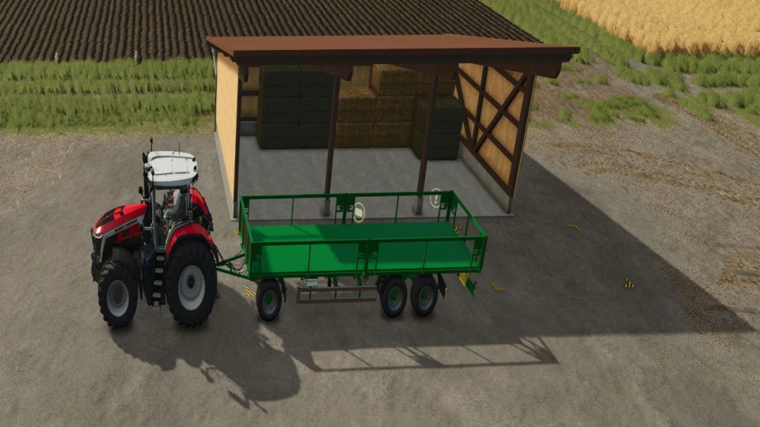 FS25 mod: Storage shed with hay bales, red tractor, and green trailer in Farming Simulator 25.