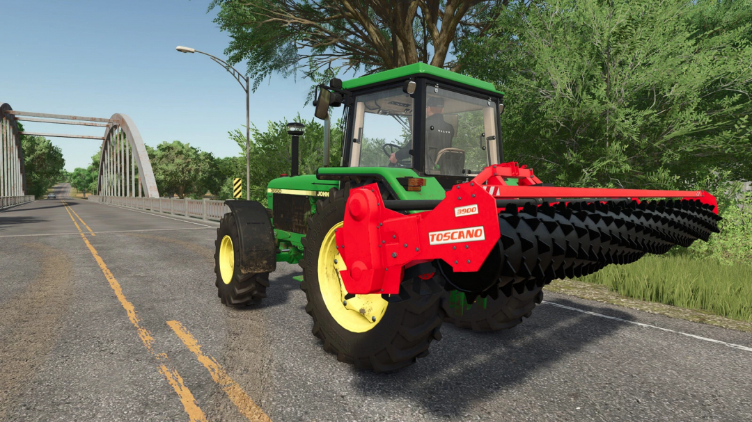 TOSCANO 3900 mod for Farming Simulator 25 on a green tractor crossing a bridge.