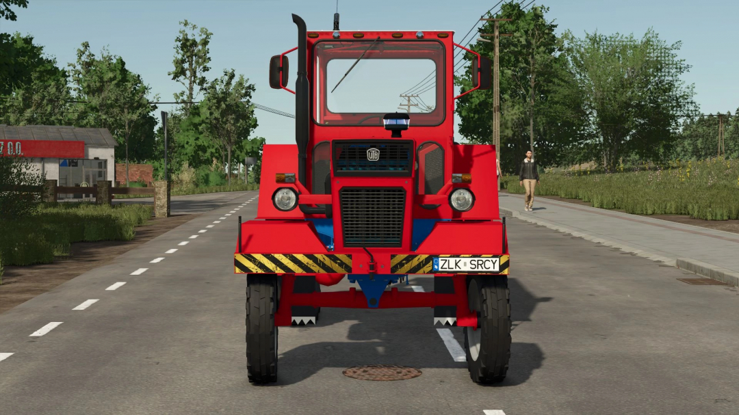 Front view of U650M tractor mod in FS25 with red body on a rural road.