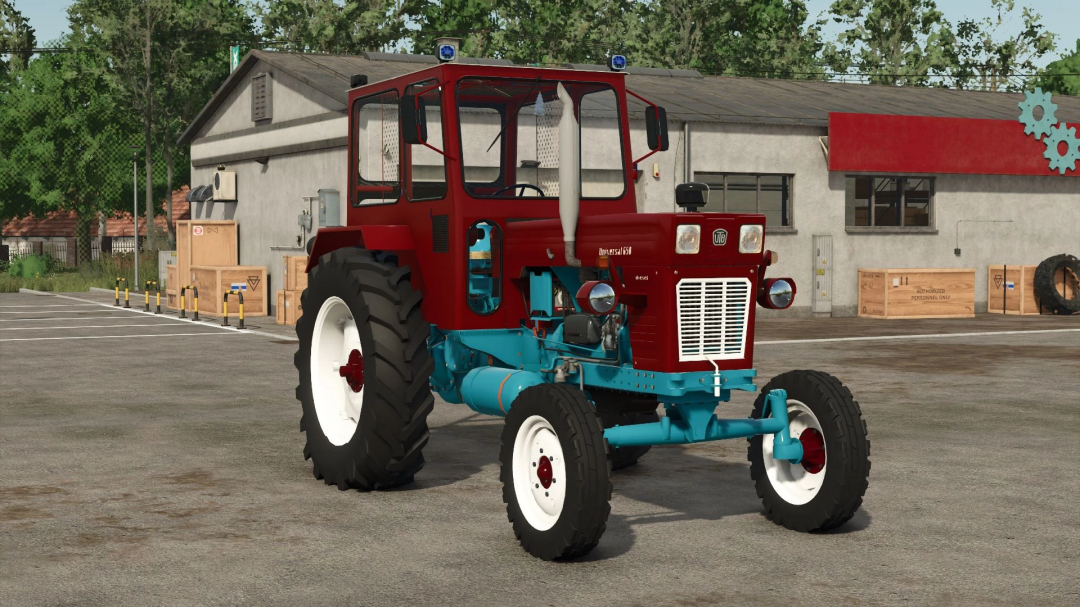 UTB 650 VMR tractor mod in Farming Simulator 25, showcasing a vintage red and blue design near a building.