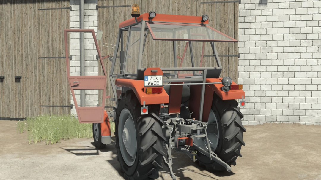 FS25 mod Ursus 3512/Massey Ferguson 255 tractor with open door, displayed in front of a barn.