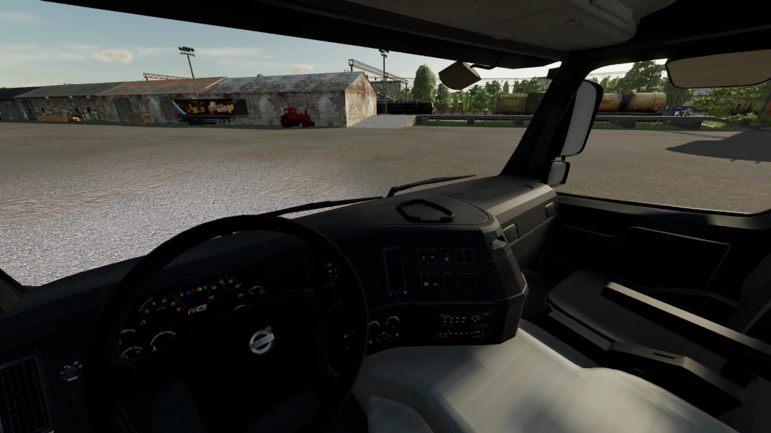 Interior view of Volvo FM13 Truck in FS22 mod, showcasing dashboard and outside scenery.