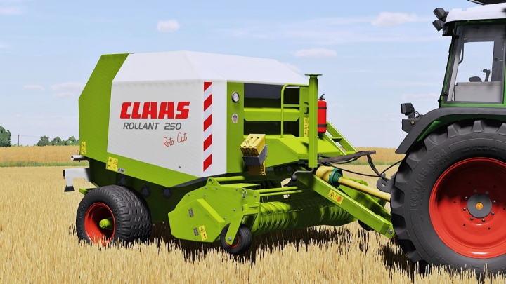 fs25-mods, Claas Rollant 250RC baler in FS25 mod, attached to a tractor, in a wheat field. Farming Simulator 25 mods enhance gameplay.