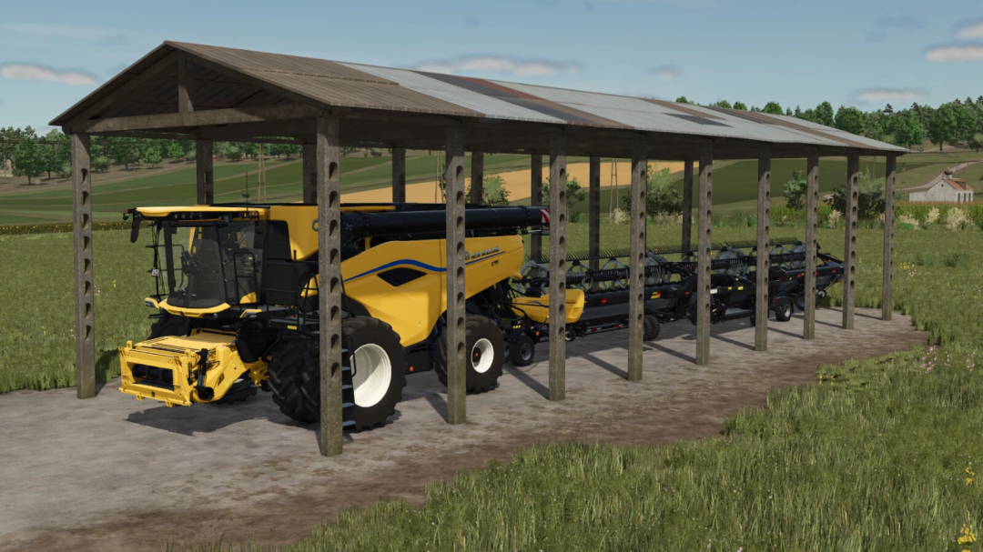 FS25 Building Farm Set mod featuring a yellow harvester under a wooden shelter in a field.