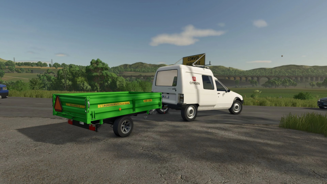 FS25 mod Citroën C15 v1.6.0.0 with green trailer in a rural setting.