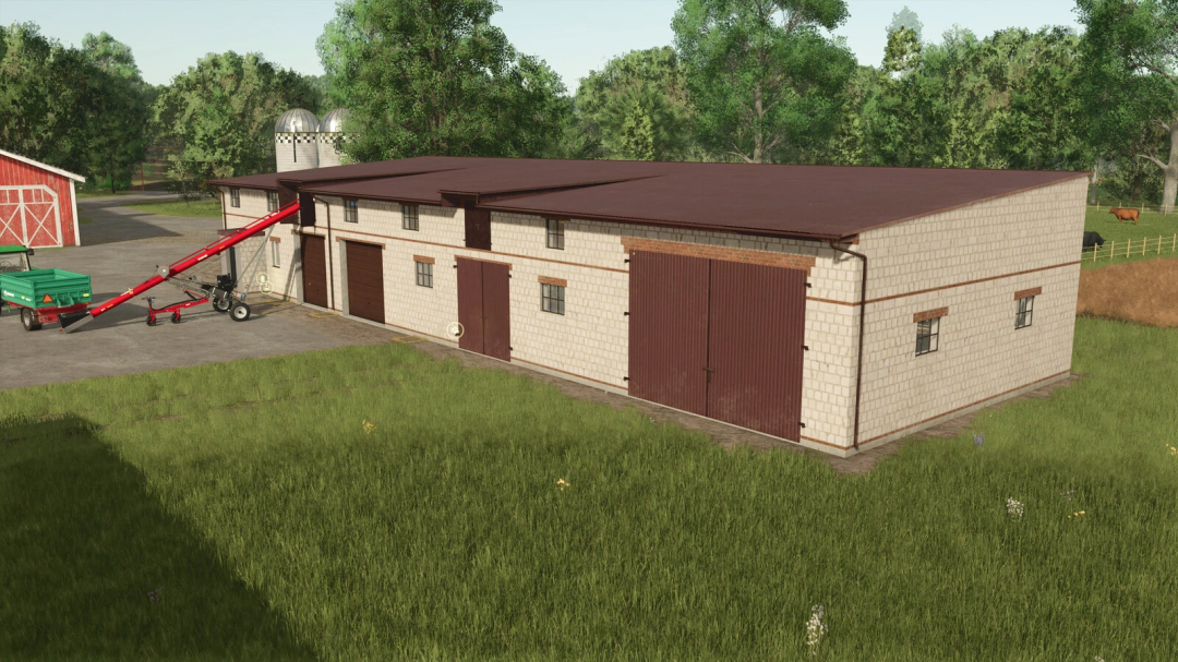 Cowshed with garage mod in FS25, showcasing a brick building and equipment in a farm setting.