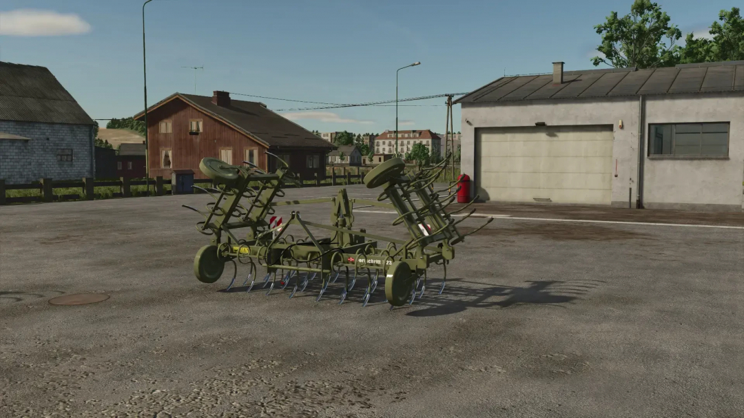 Fortschritt B-231 hay tedder mod in FS25, displayed outside a barn on a farm.