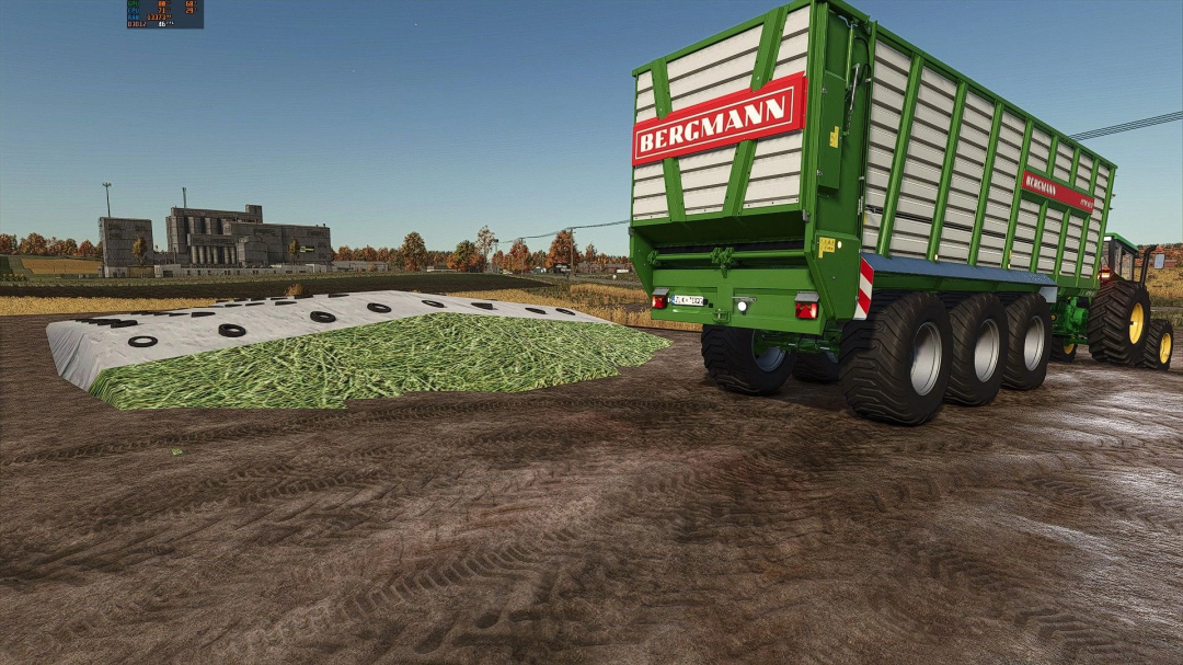 FS25 mods: Hay and straw silos mod v1.0.0.1 shows a trailer by a pile of covered silage on a farm.