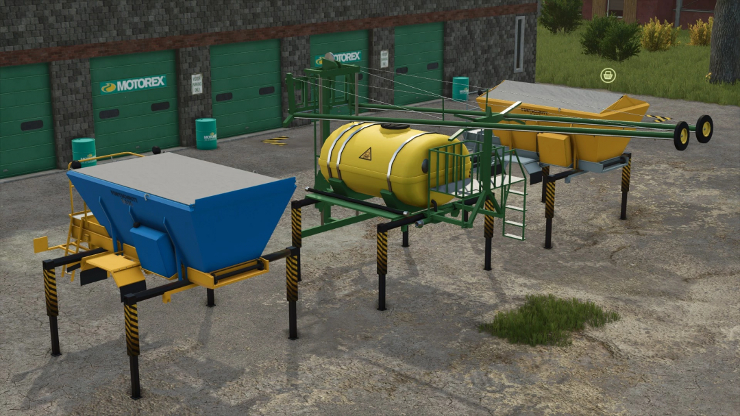 IFA W50 & Swap Bodies Pack in FS25, featuring blue and yellow containers near a garage.