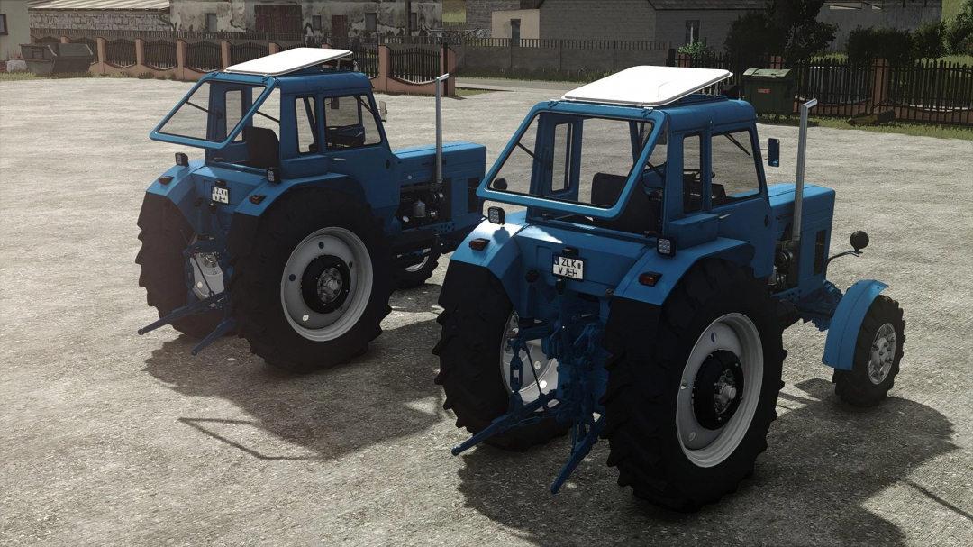 Two blue MTZ 82 tractors parked in a yard, featured in FS25 mods, Farming Simulator 25.