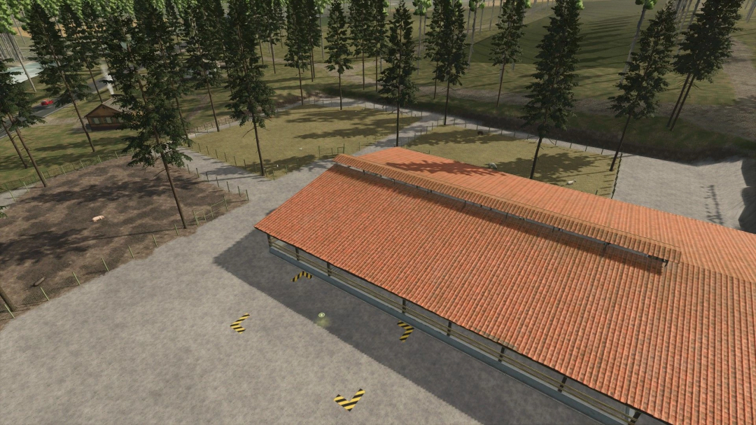 Aerial view of Old Kiwi Farm mod in FS25, featuring a barn with a red roof surrounded by fenced fields and trees.