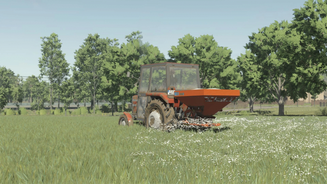 Tractor using RAUCH ZSA580 mod in Farming Simulator 25 spreading seeds in a field.