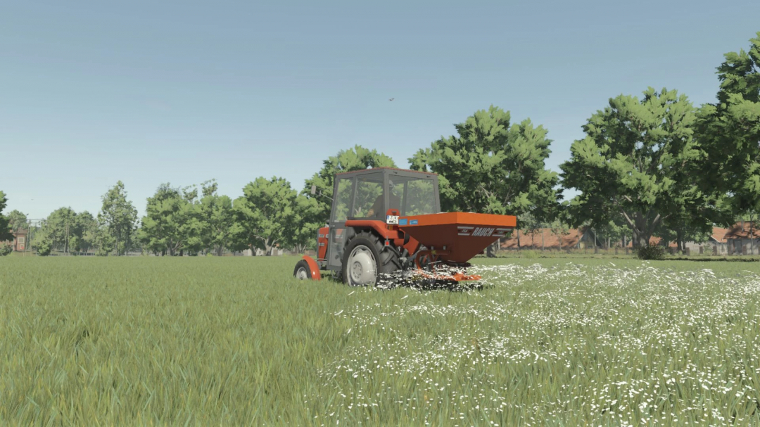 FS25 mod RAUCH ZSA580 in a field spreading fertilizer.