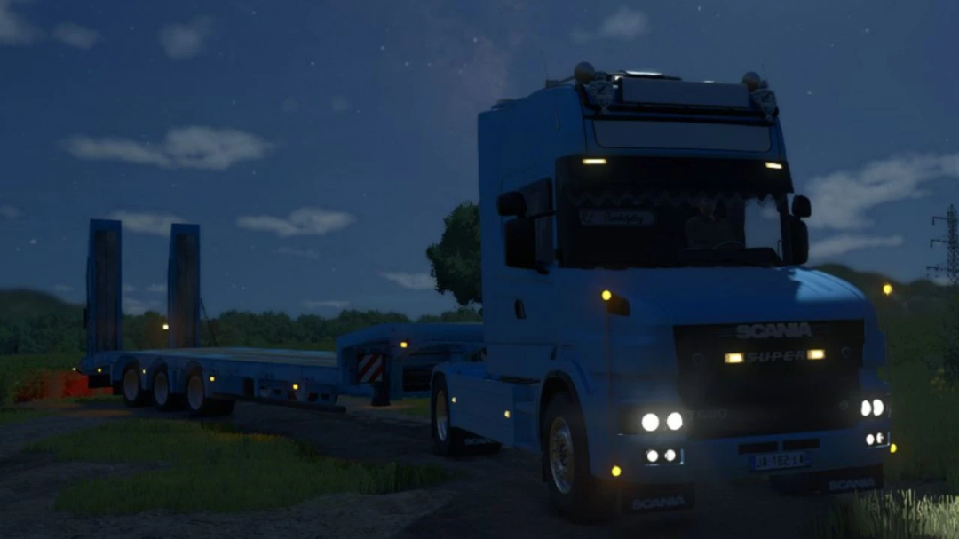 Blue Scania T truck with trailer under moonlit sky in FS25 mod.