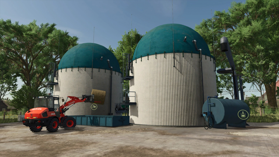 Small Biogas Plants mod in FS25 with tractor near silos surrounded by trees.