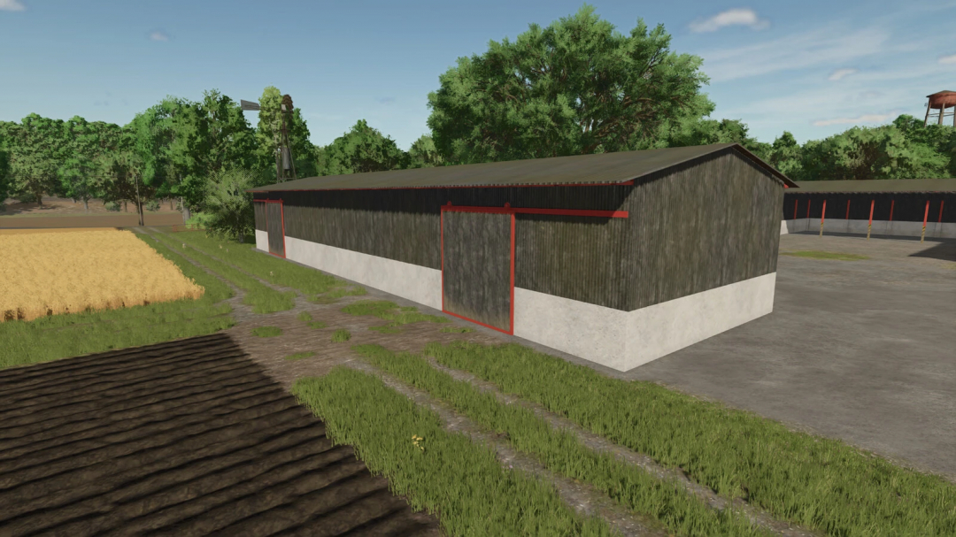 Steel shed in FS25 mod Steel Sheds Pack v1.0.0.0, featuring a long metal building with red accents, surrounded by fields and trees.