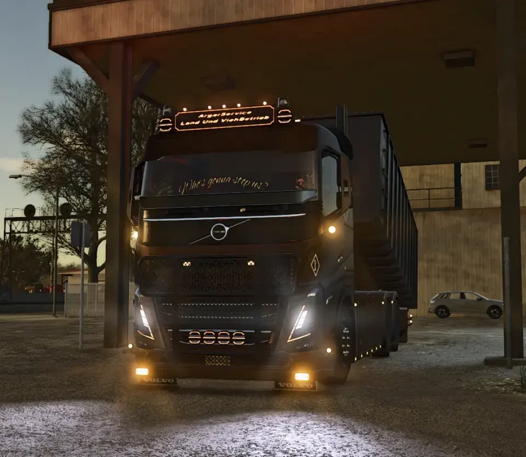 Volvo FH16 Complete Package v1.0.0.0 mod for FS25, showing a black truck with lights on, under a building structure.