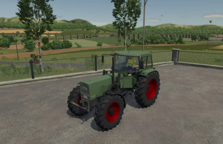 fs25-mods, Fendt Favorit S tractor mod in FS25 on a rural road with fields and viaduct in the background.