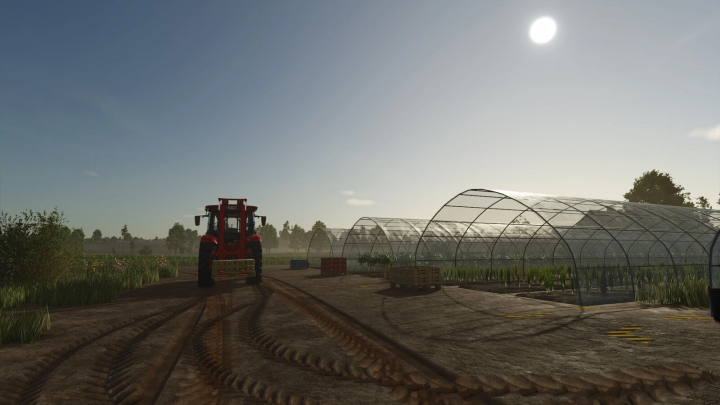 fs25-mods, Foil Tunnel mod in FS25 showing a farm tractor near greenhouses under a bright sky.