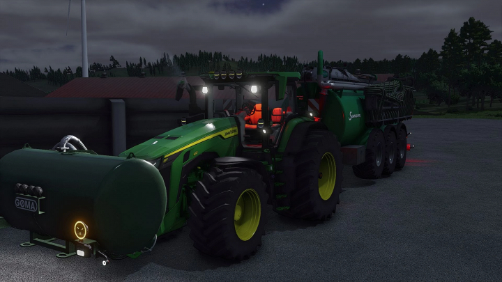 fs25-mods, John Deere 8R Series tractor mod in FS25, towing a heavy-duty tanker, showcased in a nighttime farm setting.