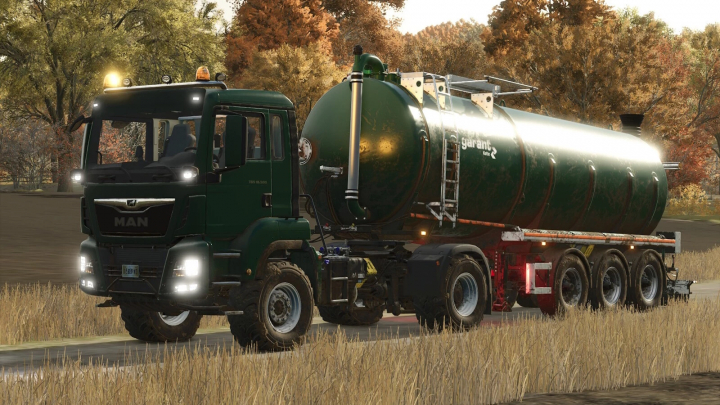 fs25-mods, MAN TGS 18.500 4x4 truck mod in Farming Simulator 25, transporting a large green tank through a rural landscape.