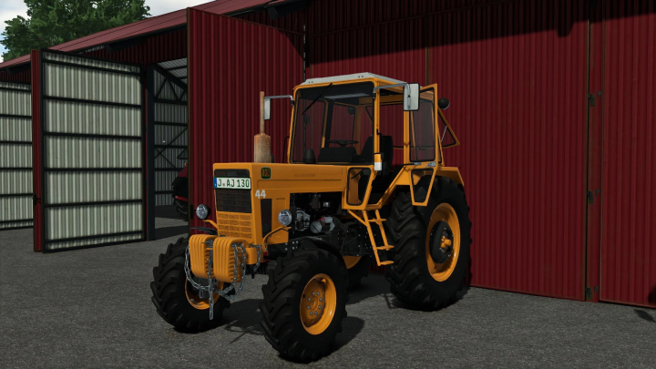 fs25-mods,  FS25 mod MTZ 82UK IKR v1.0.0.1, a yellow tractor parked by a red barn in Farming Simulator 25.