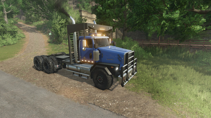 fs25-mods, Western Star SB truck mod in FS25, parked on a dirt path in a lush forest setting.