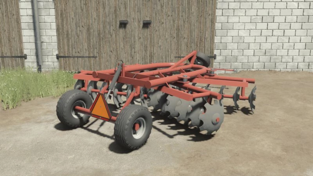 Disc Harrow 2.7m mod for FS25, showcasing a red farming tool with wheels against a barn background.