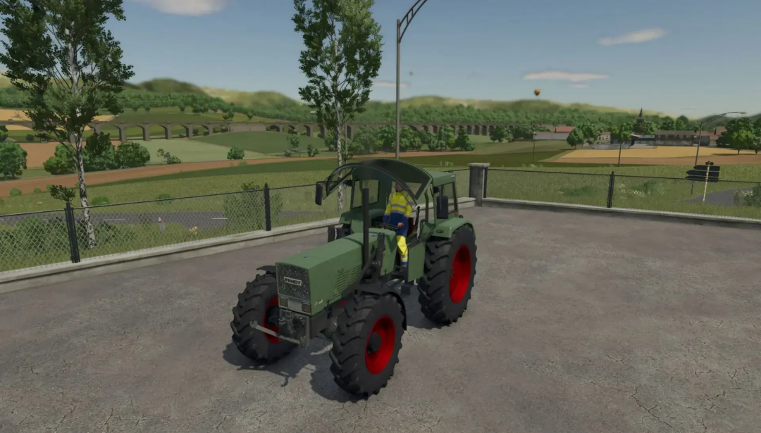 Fendt Favorit S mod in Farming Simulator 25 showcasing a vintage tractor with vibrant red wheels parked on a farm.