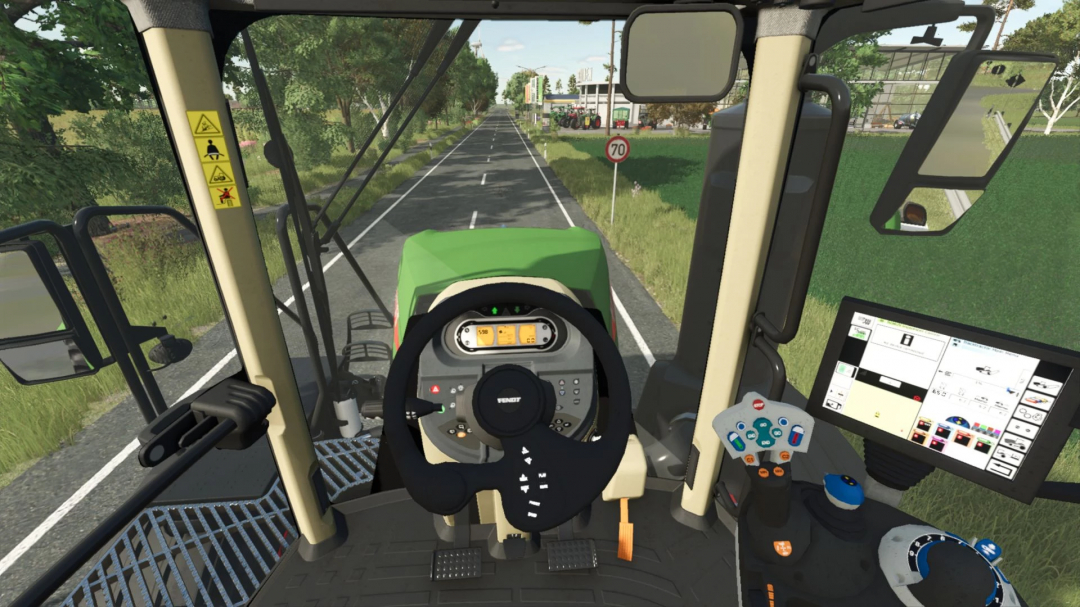 View from inside Fendt Rogator mod cockpit in FS25, showing controls and road ahead.