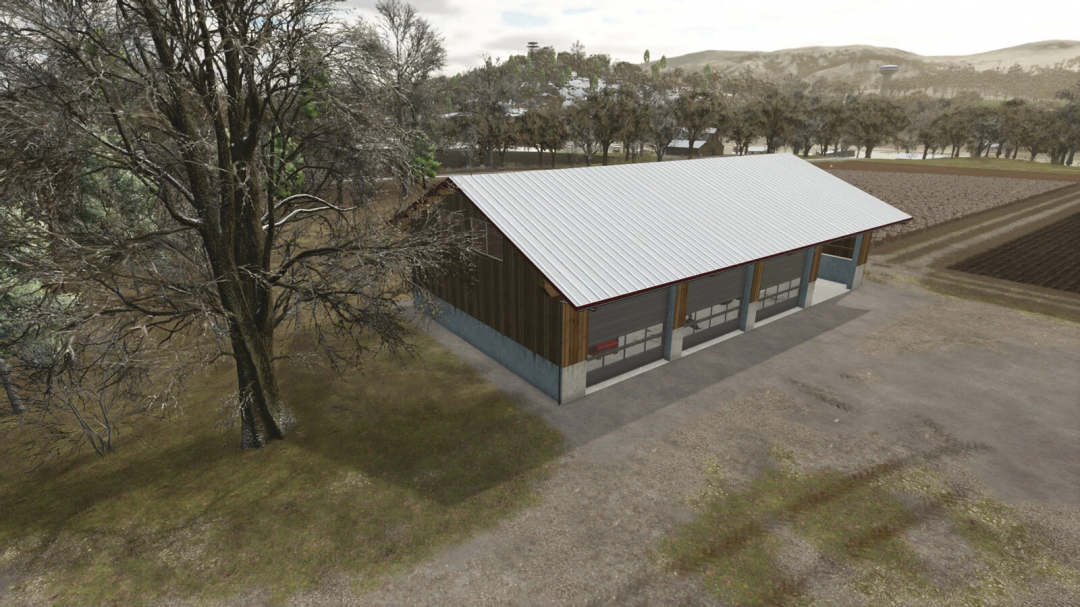 Machine Hall mod for FS25 features a large building with a metal roof in a rural setting with fields and trees.