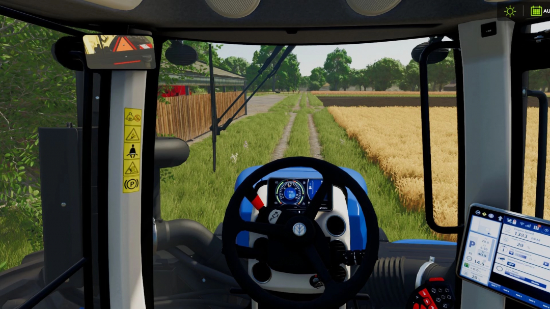 Interior view of New Holland T9 mod in FS25, showing steering wheel and farm landscape through windshield.