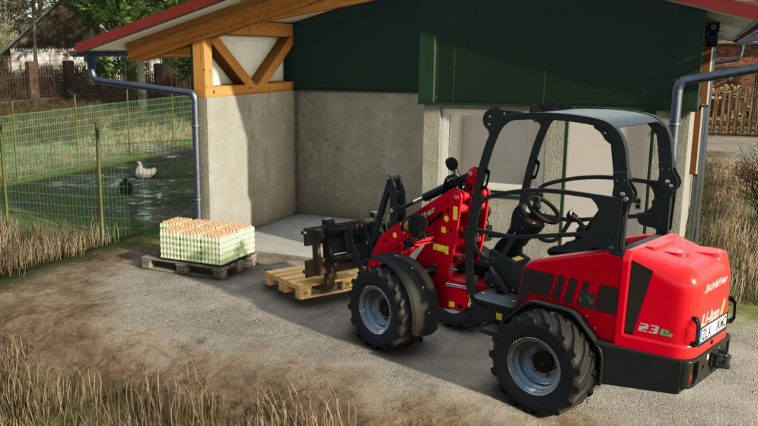 FS25 mod Schäffer Miniloader 23e with pallets next to a barn.