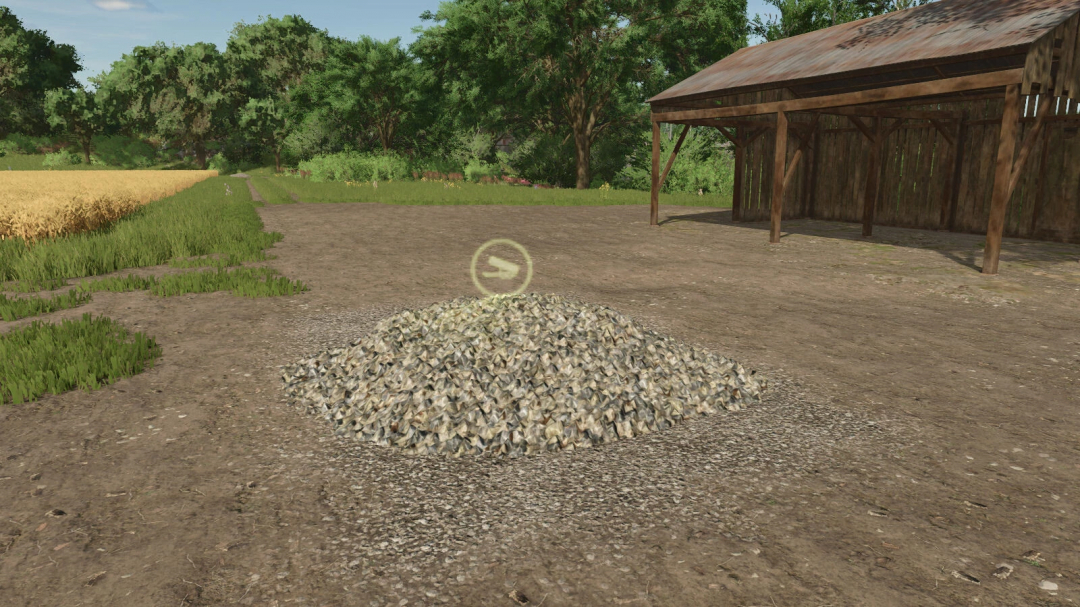 Stone Selling Station mod for FS25, showing a pile of stones in a rustic farm setting.