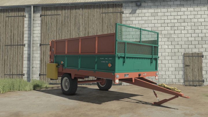 fs25-mods,  Agromet Warfama N-237/1 trailer mod for FS25 parked in front of a barn.